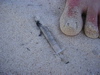 syringe on the beach