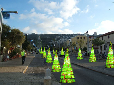 The German Colony is decorated for the festival. The lamp posts fly the flags of Israel and Haifa, and plastic Christmas trees are covered with garlands. (Photo courtesy of Hadas Itzcovich)