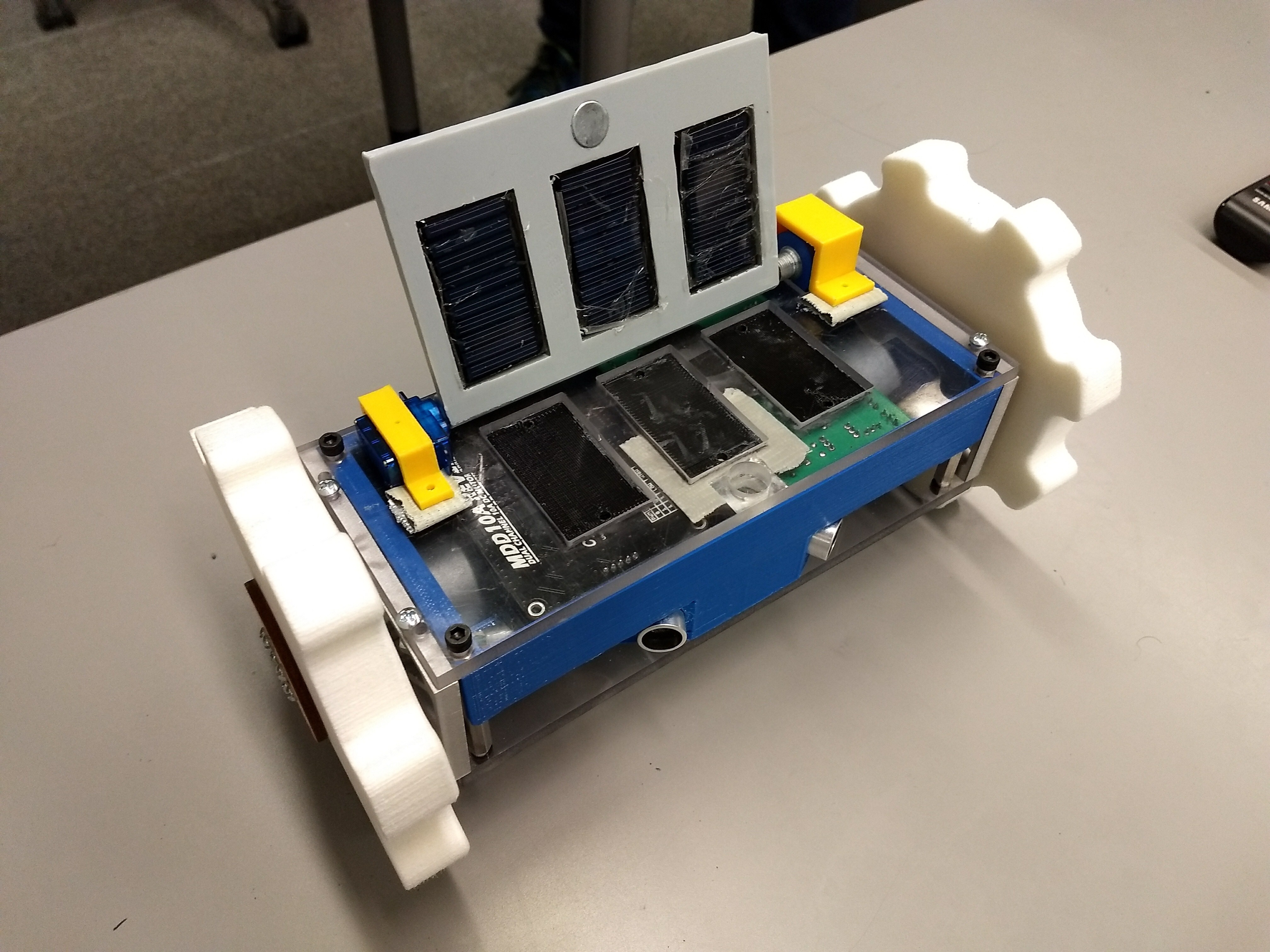 Autonomous rover for NASA Student Launch. Requirements were that it autonomously deployed on the ground after the rocket landed, drove 5 ft, and deployed a set of solar panels.