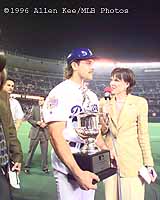 Piazza is presented with the All Star MVP trophy